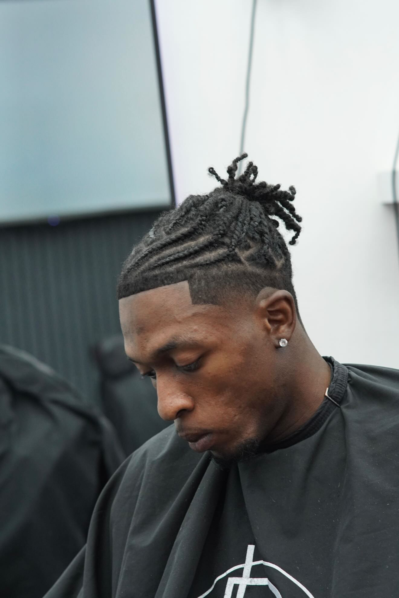 Twists with line design and fade at PB Barbers